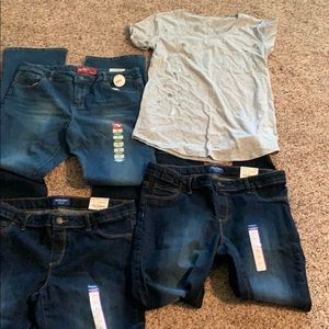 Selling teenage girls jeans and shirt.